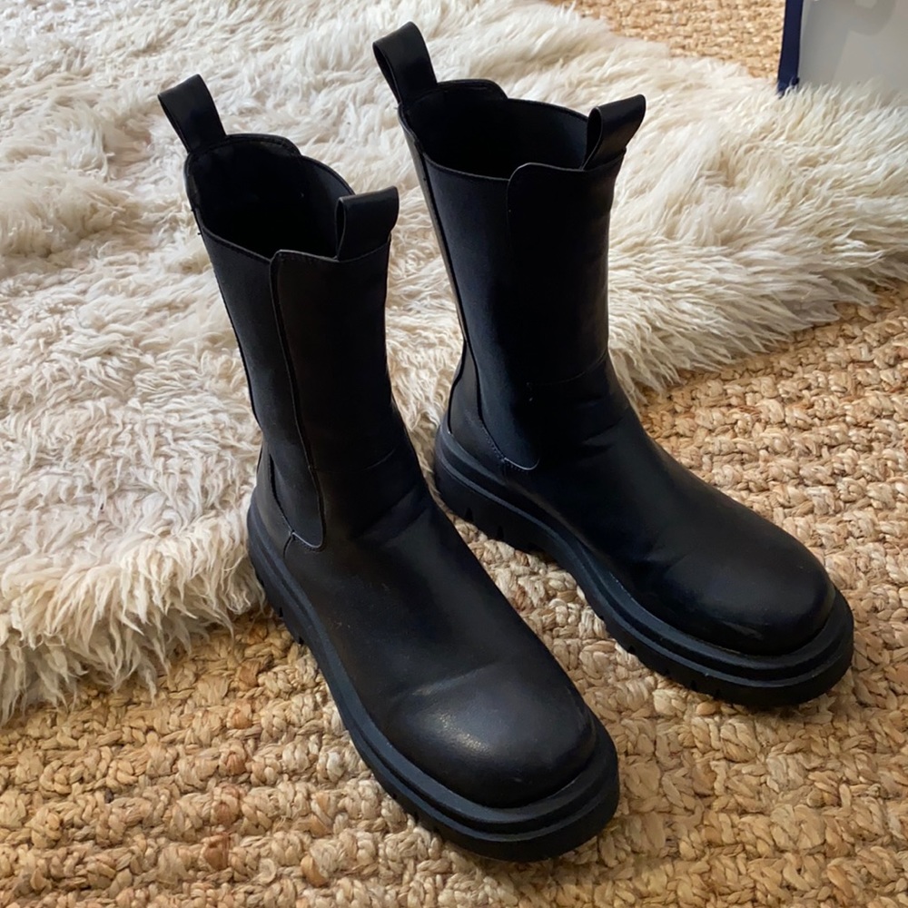 Tall black combat boots